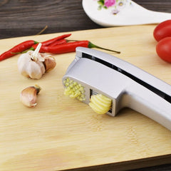 Presse-ail double fonction, hachoir et trancheur - Gadget de cuisine