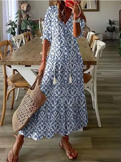 Robe mi-longue bohème chic à col en V et manches trois-quarts