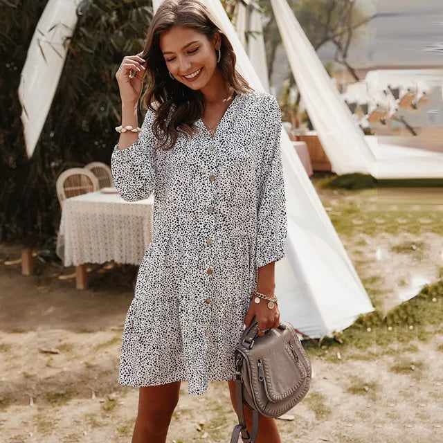 Robe fleurie chic à manches trois-quarts