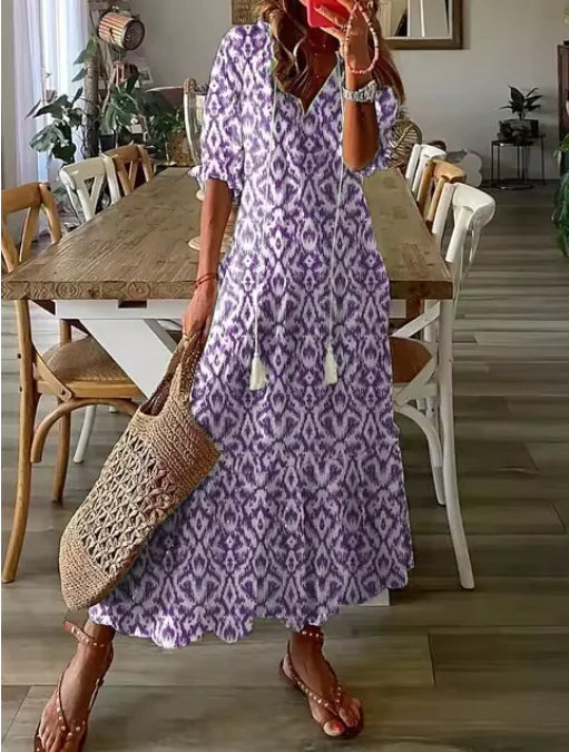 Robe mi-longue bohème chic à col en V et manches trois-quarts