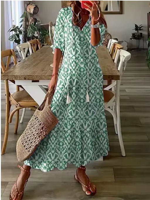Robe mi-longue bohème chic à col en V et manches trois-quarts